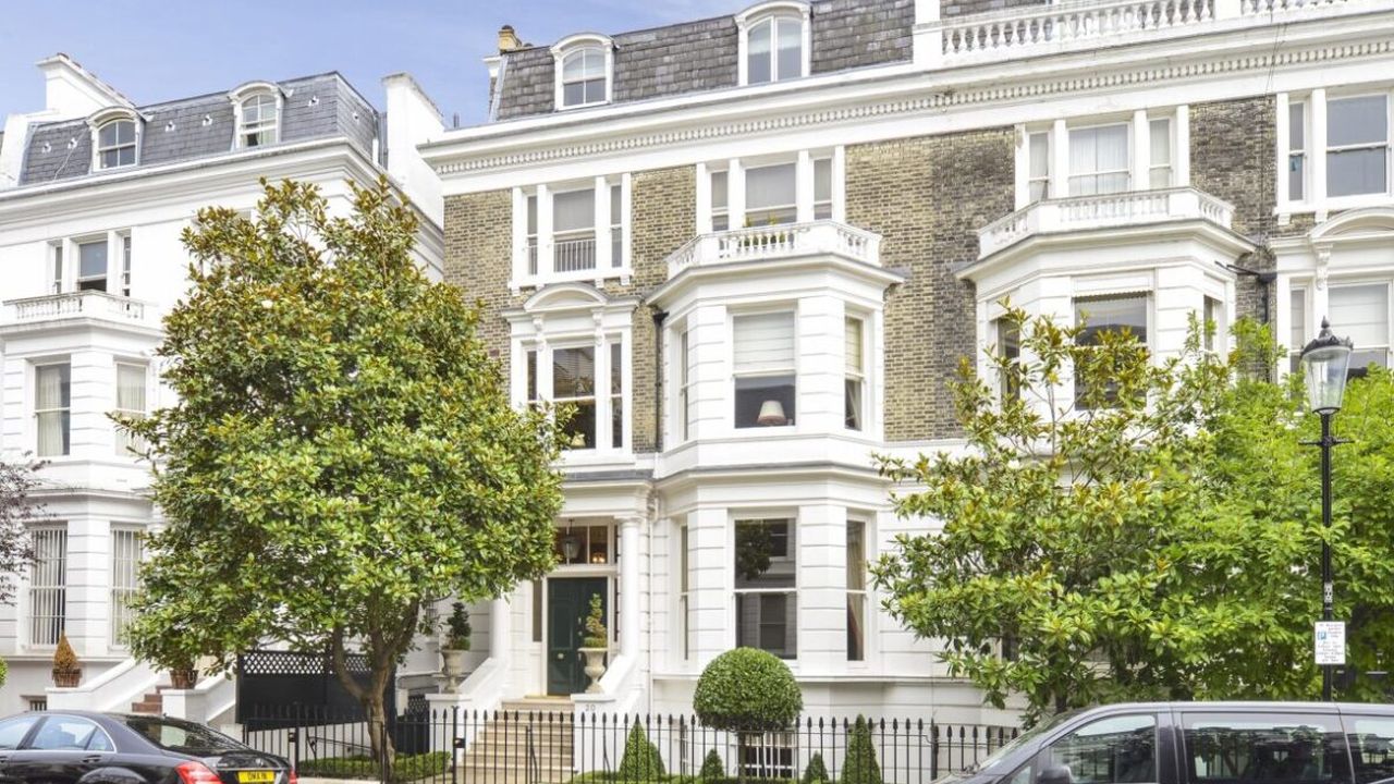 White stucco Victorian townhouses on Upper Phillimore Gardens, London
