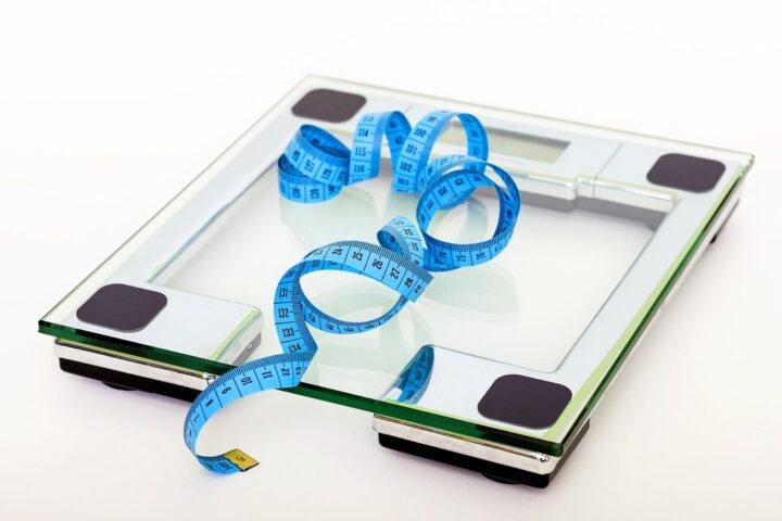 Glass bathroom scales with a tape measure