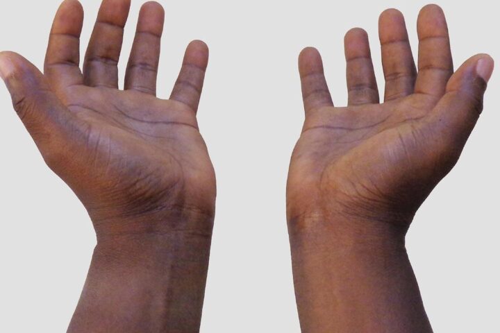 Two open hands held out to give