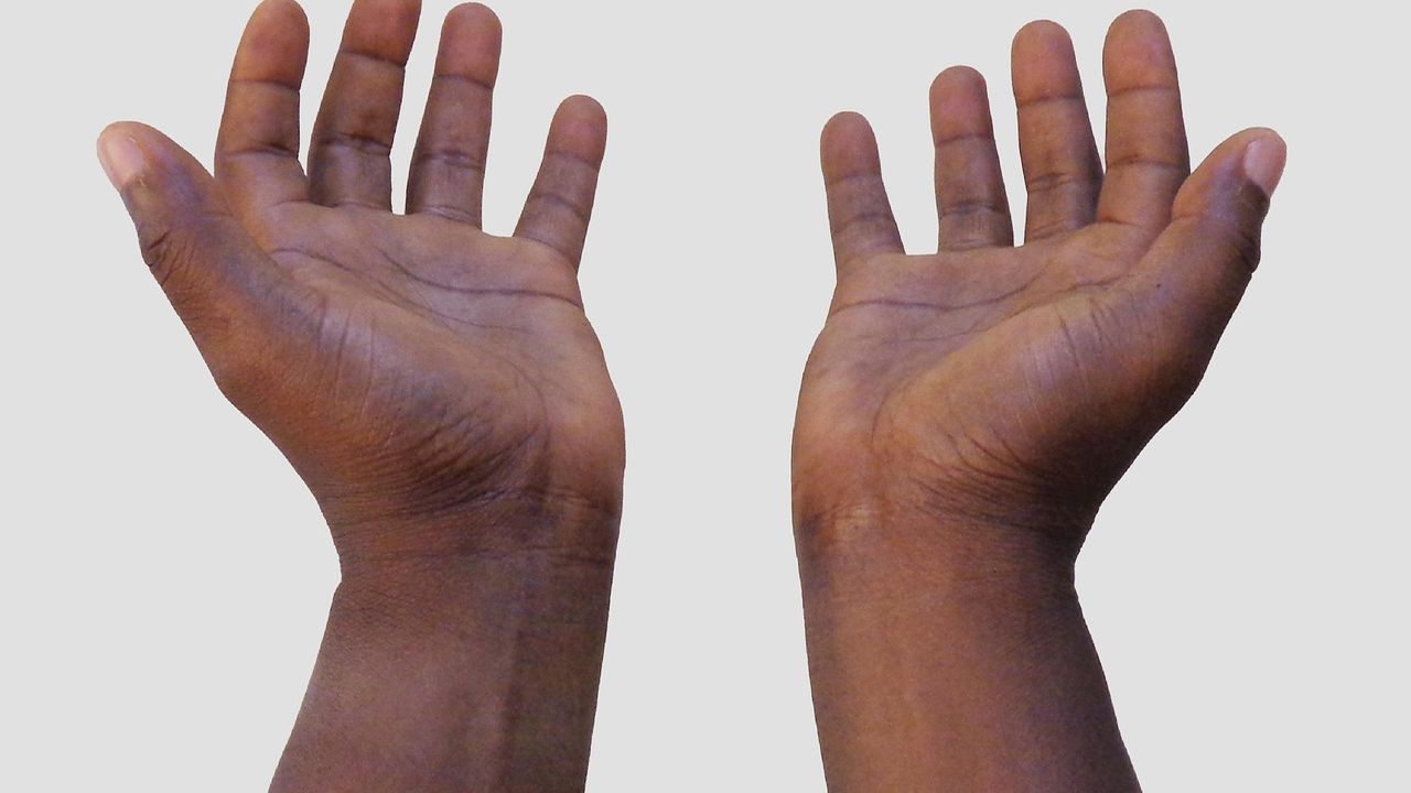 Two open hands held out to give
