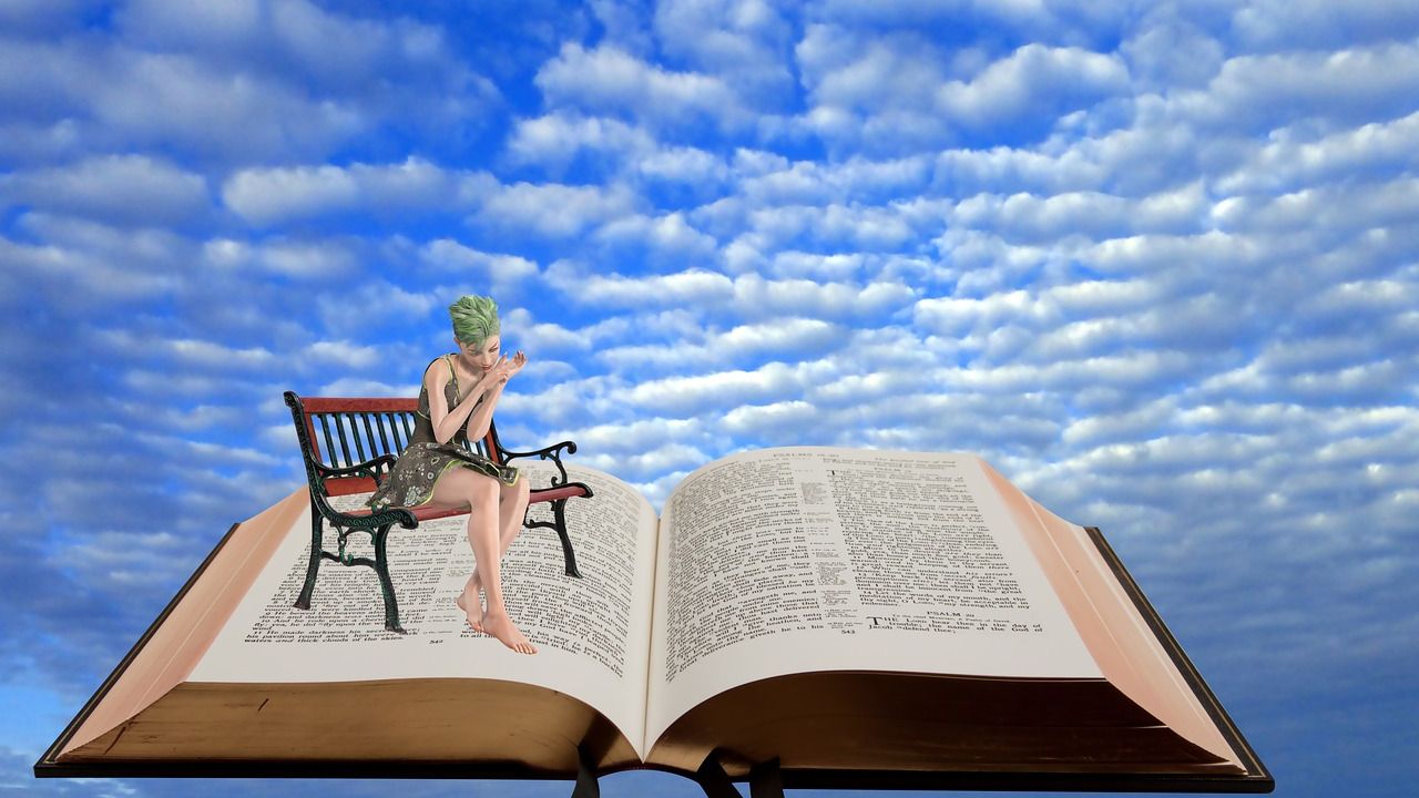 Woman on a bench sitting on a giant open book in the clouds