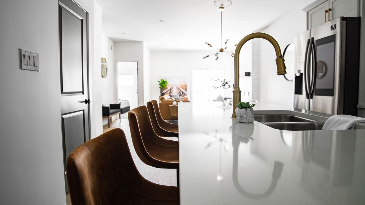 Bright modern kitchen with island and bar stools